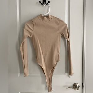 Backless Bodysuit. Nude